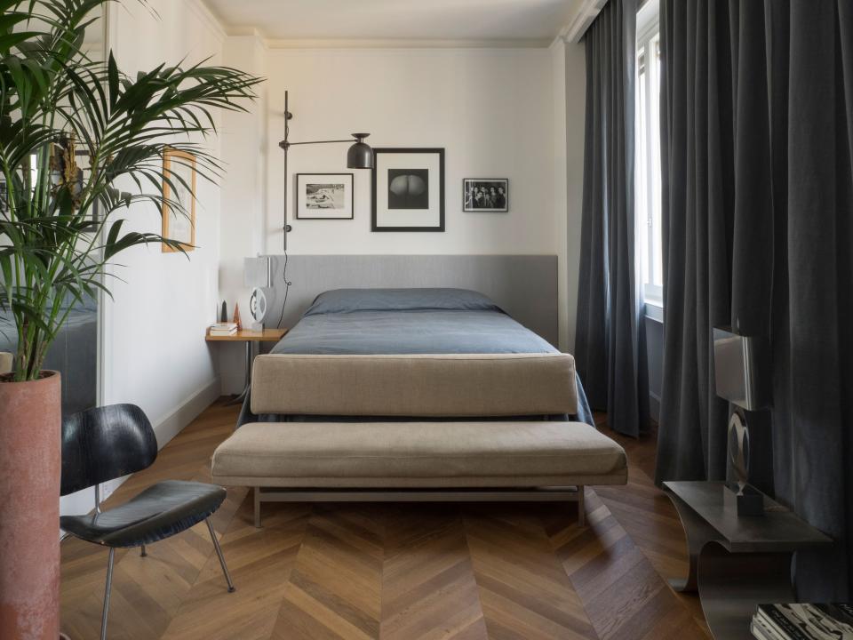 In Werz’s bedroom, the bed and wall-mounted light fixture were designed by Giorgia Longoni, the table lamp is by Maria Pergay, the sofa is by Josef Hoffmann, and the collection of art includes works by Robert Mapplethorpe, Martine Franck, and Henry Moore.