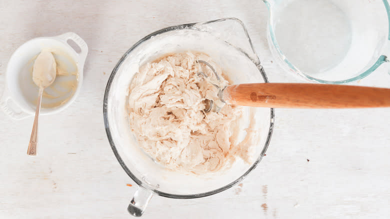 sourdough in a bowl with dough whisk
