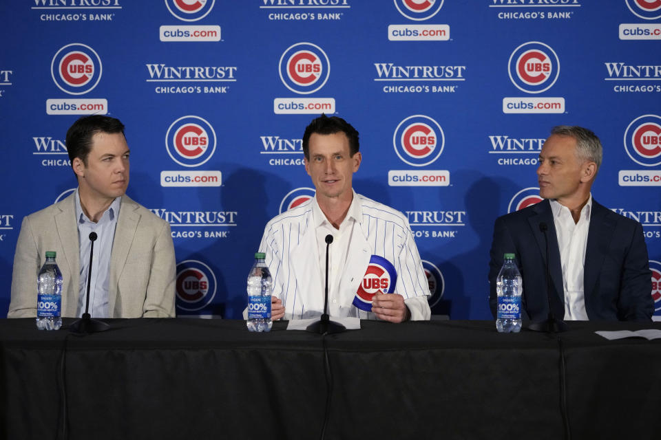 Chicago Cubs new manager Craig Counsell speaks as general manager Carter Hawkins, left, and president of baseball operations Jed Hoyer, right, look on during a press conference in Chicago, Monday, Nov. 13, 2023. (AP Photo/Nam Y. Huh)