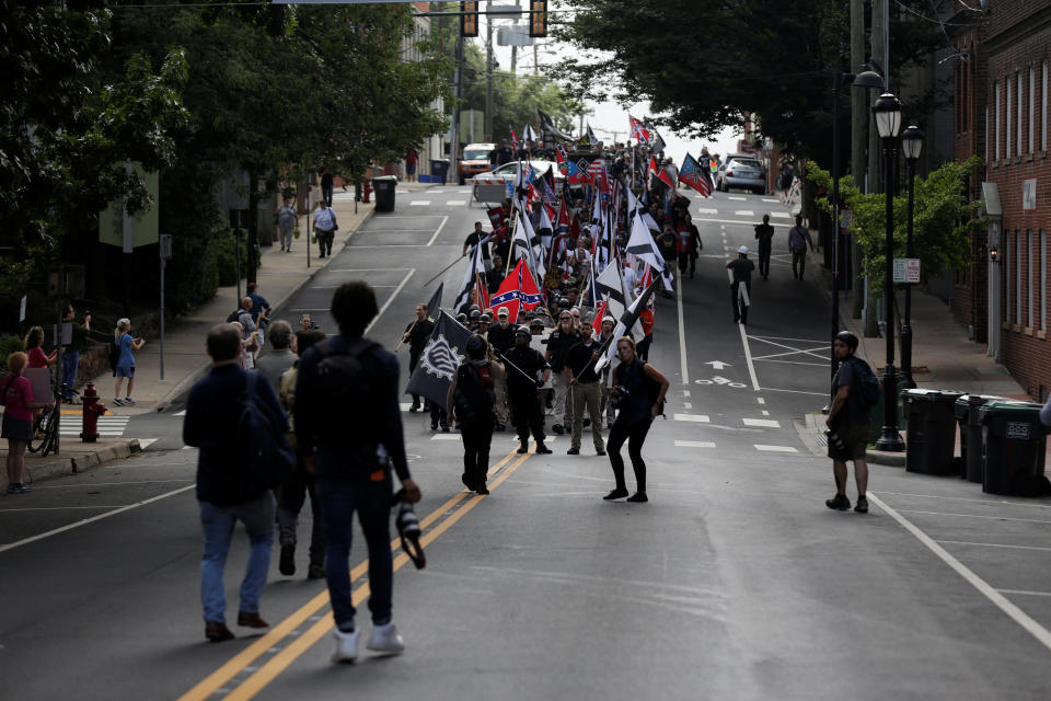 White&nbsp;nationalists march through the street.