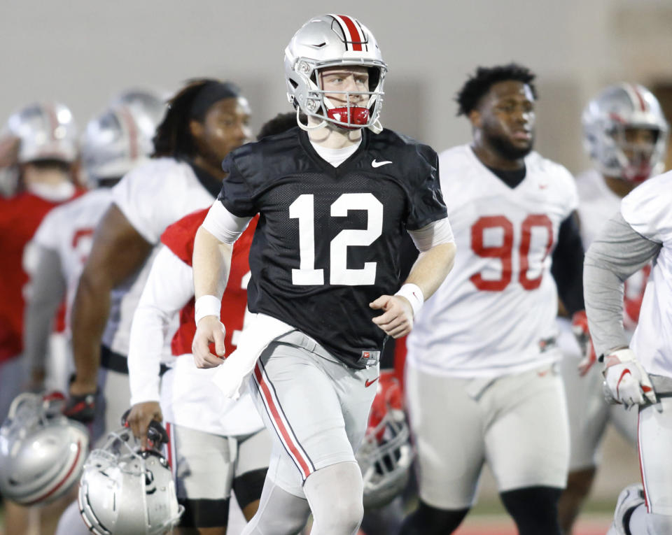 Ohio State University quarterback Matthew Baldwin runs through a drill during an NCAA college football practice in Columbus, Ohio, Wednesday, March 6, 2019. (AP Photo/Paul Vernon)