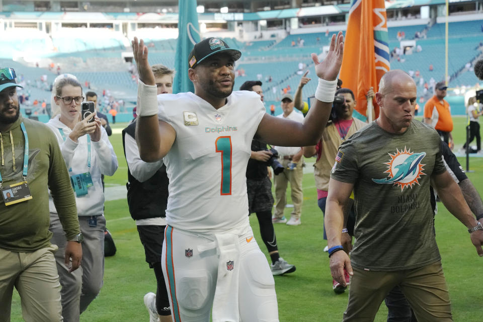 Miami Dolphins quarterback Tua Tagovailoa (1) looks up to fans as he exits the field during at the end of an NFL football game, Sunday, Nov. 13, 2022, in Miami Gardens, Fla. The Dolphins defeated the Browns 39-17. (AP Photo/Wilfredo Lee)