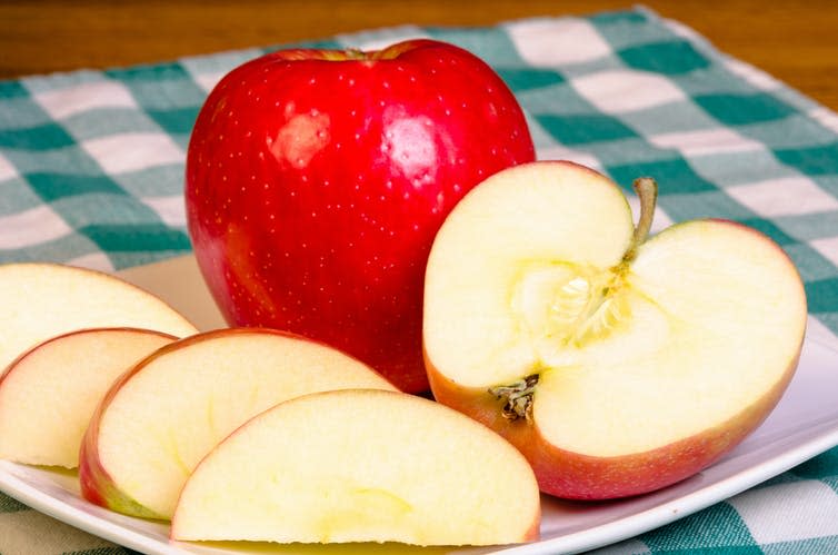 <span class="caption">An apple a day really could keep the doctor away.</span> <span class="attribution"><a class="link " href="https://www.shutterstock.com/image-photo/fresh-red-apple-sliced-on-white-119726974" rel="nofollow noopener" target="_blank" data-ylk="slk:Zigzag Mountain Art;elm:context_link;itc:0;sec:content-canvas">Zigzag Mountain Art</a></span>