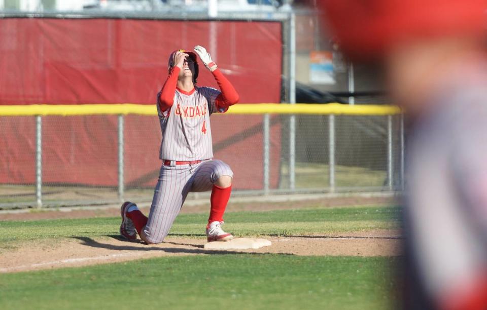 Oakdale’s Jordan Haver celebrates after hitting a triple during the CIF Sac-Joaquin Section Quarterfinals against Vista del Lago at Oakdale High School on May 9, 2024. Oakdale won 10-5.