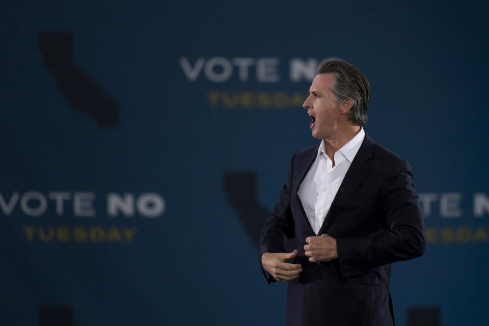 California Gov. Gavin Newsom acknowledges the cheering crowd at a rally ahead of the California gubernatorial recall election Monday, Sept. 13, 2021, in Long Beach, Calif. (AP Photo/Jae C. Hong)