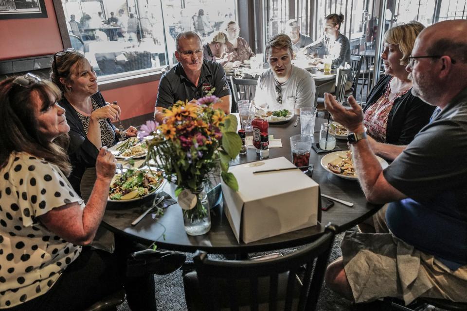 Regular diners at One North Kitchen and Bar in Delta Township celebrate a birthday Thursday, Aug. 10, 2023.