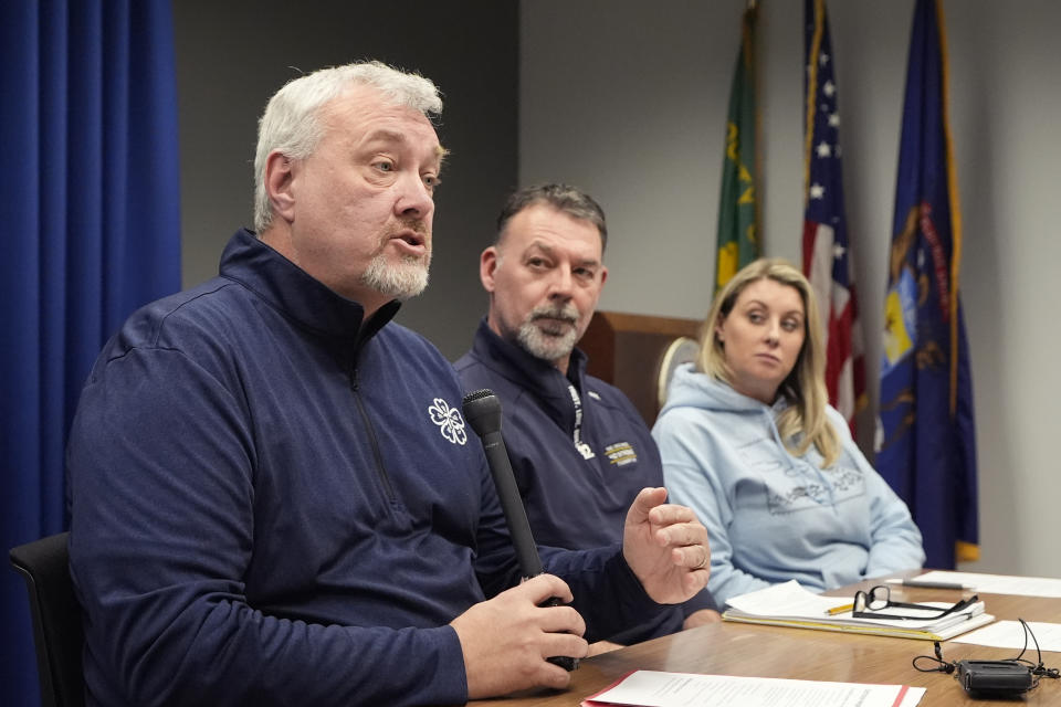 The parents of four students killed in a shooting in Michigan more than two years ago are interviewed Monday, March 18, 2024 in Pontiac, Mich. From left, Steve St. Juliana, Buck Myre and Nicole Beausoleil called for a state investigation of all aspects of the 2021 mass shooting, saying a local criminal probe that netted three is not enough to close the book. (AP Photo/Carlos Osorio)
