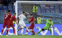 Italy's Ciro Immobile, centre, scores his side's second goal during the Euro 2020 soccer championship group A match between Turkey and Italy at the Olympic stadium in Rome, Friday, June 11, 2021. (Ettore Ferrari/Pool via AP)