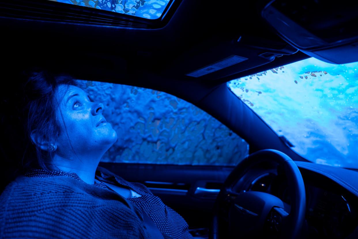 Lisa Nuñez Najera, a rape survivor whose kit was tested by the Wichita Police Department, enjoys the relative quiet of a car wash on April 5, 2024 in Wichita, Kansas.