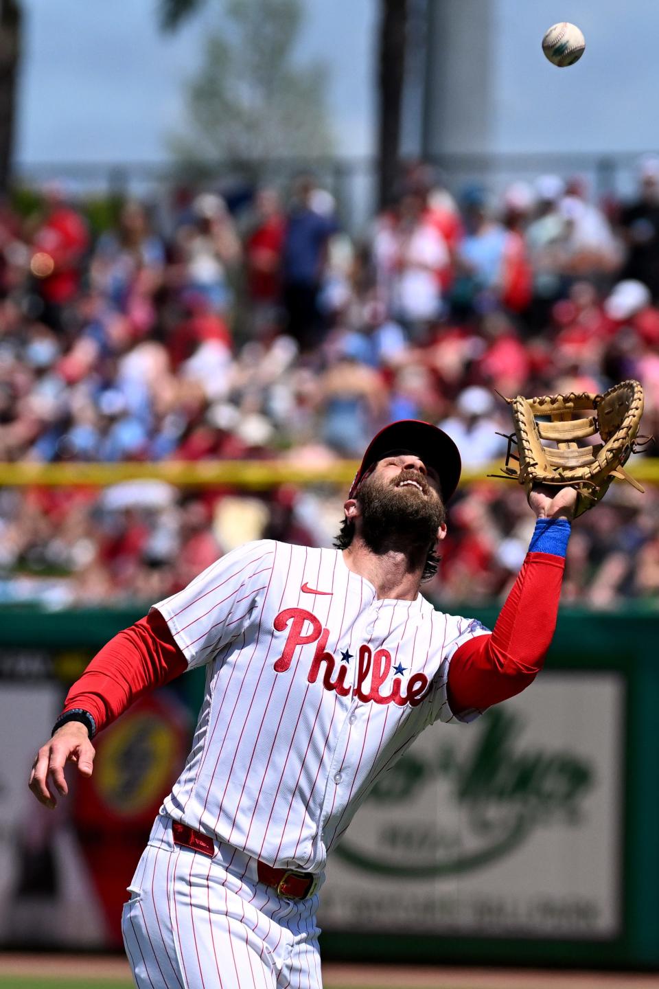 Philadelphia Phillies first baseman Bryce Harper (3) catches a fly ball in the third inning of the spring game against the Toronto Blue Jays at BayCare Ballpark.