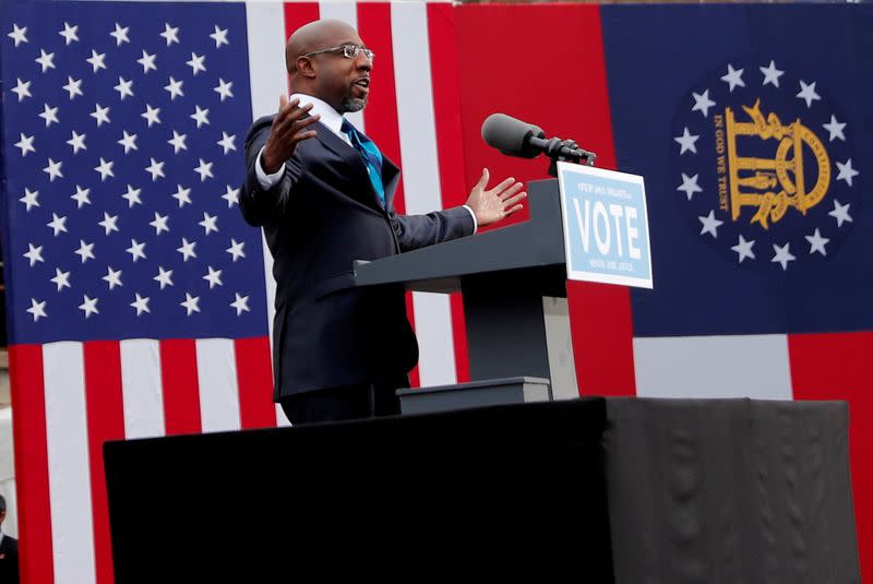 FILE PHOTO: U.S. President-elect Joe Biden campaigns on behalf of Democratic U.S. senate candidates Ossoff and Warnock in Atlanta, Georgia U.S. President-elect Joe Biden campaigns on behalf of Democratic U.S. senate candidates Ossoff and Warnock in Atlanta