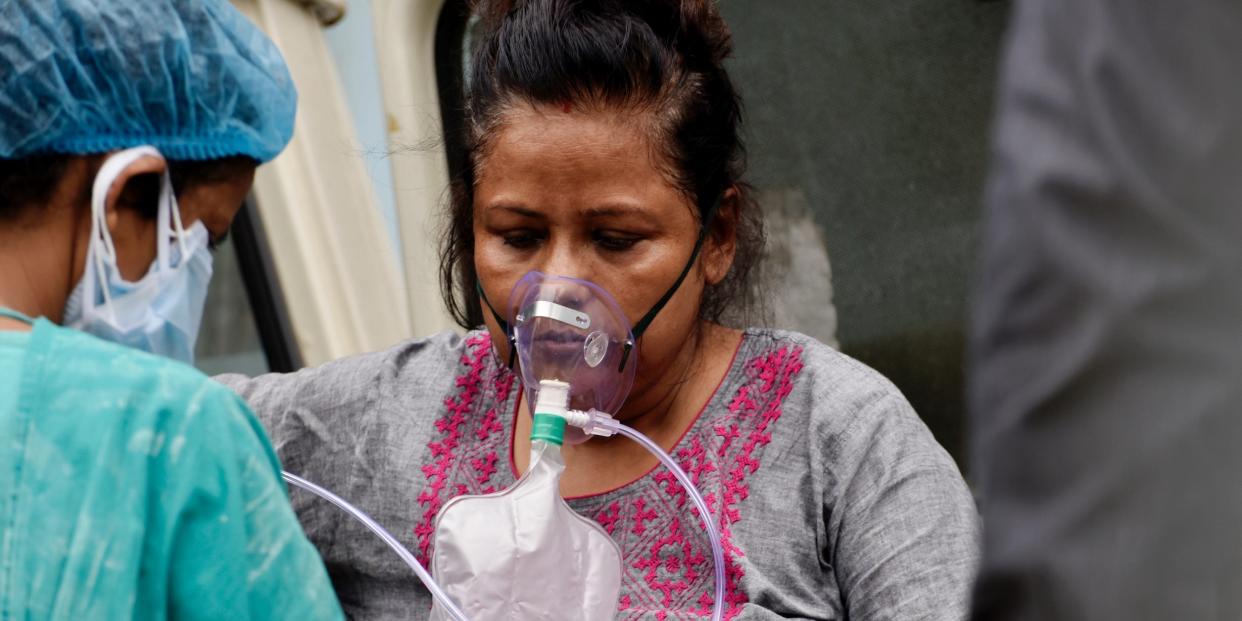 A Covid-19 patient gets admitted to a government hospital in Kolkata, India, 22 April, 2021. India reported 314,835 fresh coronavirus infections on Thursday according to an Indian media report.