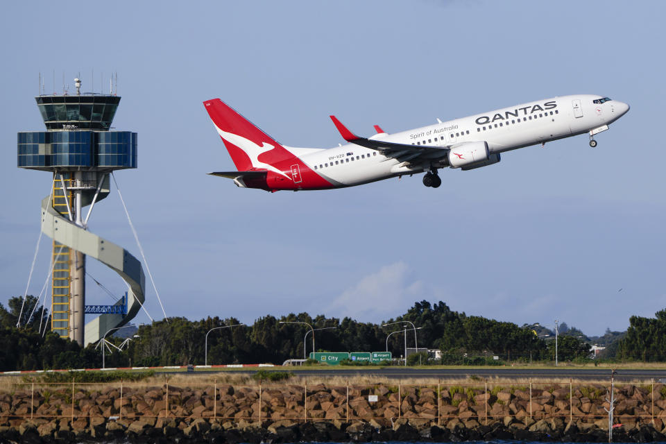 FILE - A Qantas Boeing 737 passenger plane takes off from Sydney Airport, Australia, on Sept. 5, 2022. Qantas Airways agreed to pay 120 million Australian dollars ($79 million) in compensation and fines for selling tickets on thousands of cancelled flights, the airline and Australia’s consumer watchdog said on Monday, May 6, 2024. (AP Photo/Mark Baker, File)