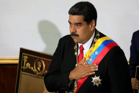 Venezuela's President Nicolas Maduro gestures during a special session of the National Constituent Assembly to take oath as re-elected President at the Palacio Federal Legislativo in Caracas, Venezuela May 24, 2018. REUTERS/Marco Bello