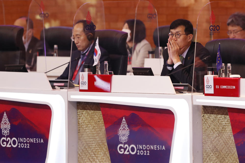 Bank of Korea Governor Rhee Chang-yong, right, and South Korean Finance Minister Choo Kyung-ho, left, attends the G20 Finance Ministers and Central Bank Governors Meeting in Nusa Dua, Bali, Indonesia, Friday, July 15, 2022. Top financial officials from the Group of 20 leading rich and developing nations are gathering on the Indonesian island of Bali for meetings that begin Friday. (Made Nagi/Pool photo via AP)