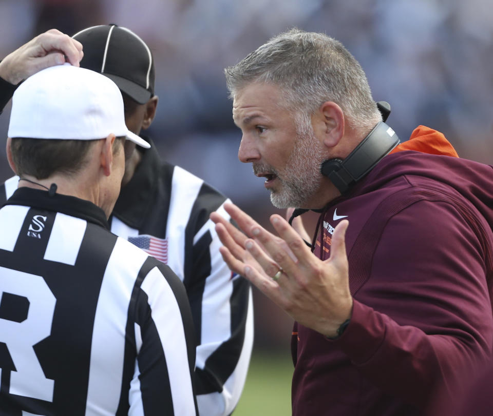 Virginia Tech head coach Justin Fuente disputes an official's call in the first half of an NCAA college football game against Pittsburgh, Saturday, Oct. 16 2021, in Blacksburg, Va. (Matt Gentry/The Roanoke Times via AP)