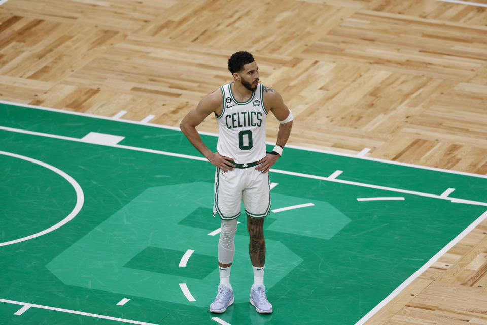 Boston Celtics forward Jayson Tatum (0) stands on the court in the second half of Game 1 of the NBA basketball Eastern Conference finals playoff series against the Miami Heat in Boston, Wednesday, May 17, 2023. The Heat won 123-116. (AP Photo/Michael Dwyer)