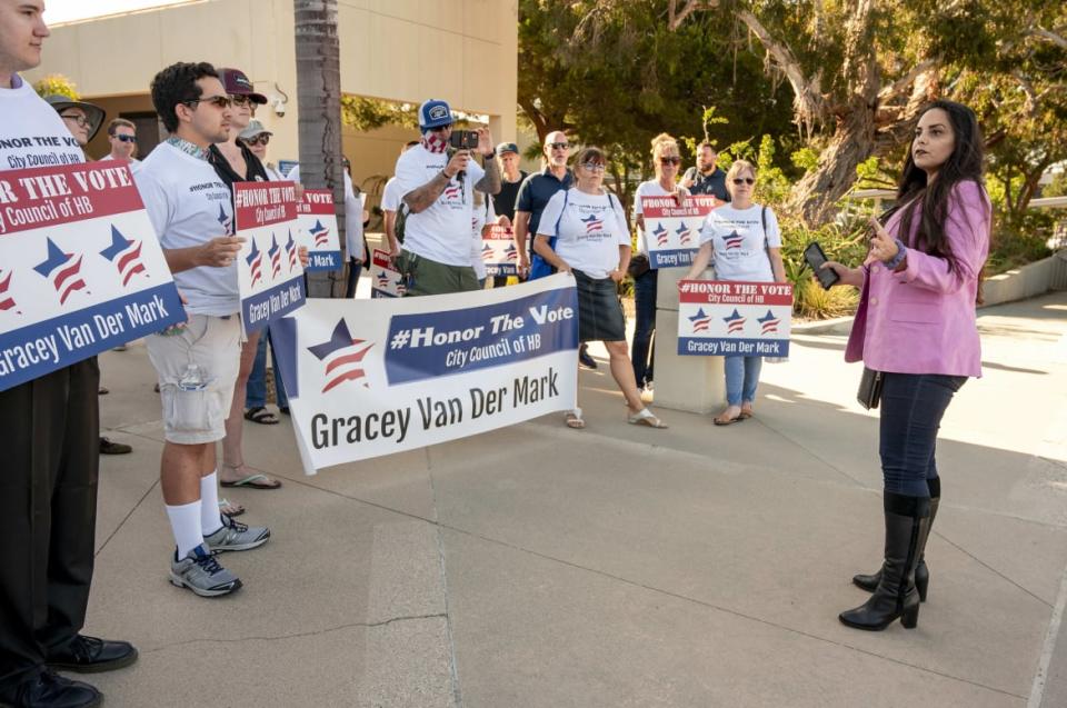 <div class="inline-image__caption"><p>"Gracey Van Der Mark, right, speaks to supporters prior to a special meeting of the Huntington Beach City Council in Huntington Beach on Monday, July 19, 2021 to choose a replacement for Tito Ortiz's seat out of more than 100 applicants."</p></div> <div class="inline-image__credit">MediaNews Group/Orange County Register via Getty</div>