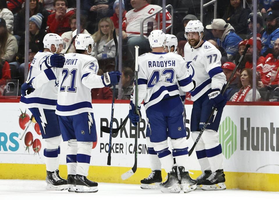 Tampa Bay Lightning defenseman Victor Hedman, right, celebrates with teammates after scoring against the Detroit Red Wings during the first period of an NHL hockey game Sunday, Jan. 21, 2024, in Detroit. (AP Photo/Duane Burleson)