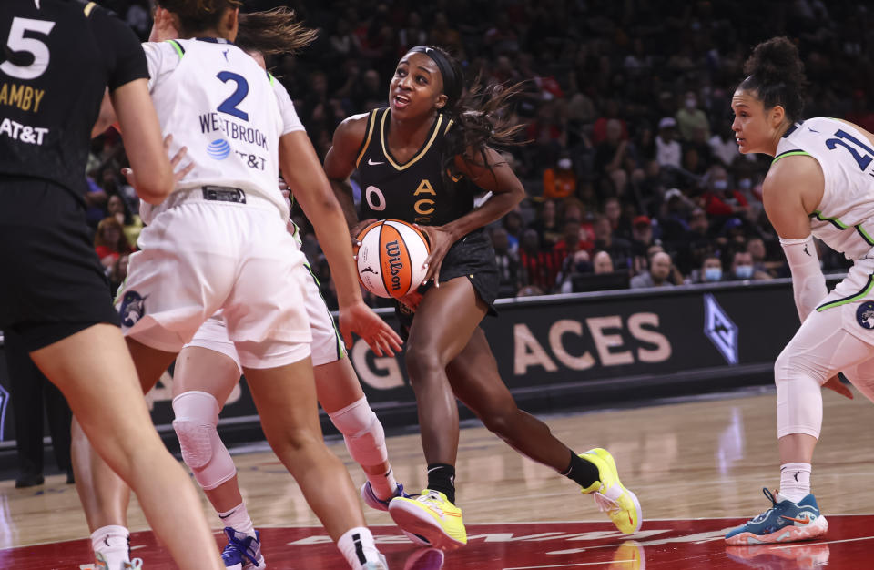 Las Vegas Aces guard Jackie Young (0) drives to the basket against the Minnesota Lynx during the second half of a WNBA basketball game Sunday, June 19, 2022, in Las Vegas. (Chase Stevens/Las Vegas Review-Journal via AP)