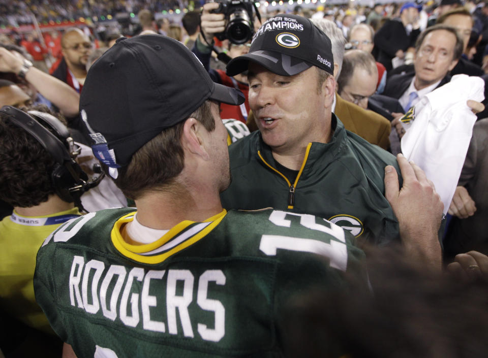 FILE - Green Bay Packers head coach Mike McCarthy, right, and quarterback Aaron Rodgers celebrate after beating the Pittsburgh Steelers 31-25 in the NFL Super Bowl XLV football game Sunday, Feb. 6, 2011, in Arlington, Texas. Rodgers won his lone Super Bowl title with McCarthy as his coach before their relationship eventually soured. (AP Photo/David J. Phillip, File)