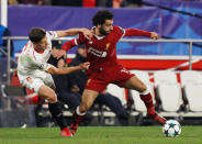 Soccer Football - Champions League - Sevilla vs Liverpool - Ramon Sanchez Pizjuan, Seville, Spain - November 21, 2017 Liverpool's Mohamed Salah in action with Sevilla’s Clement Lenglet Action Images via Reuters/Matthew Childs