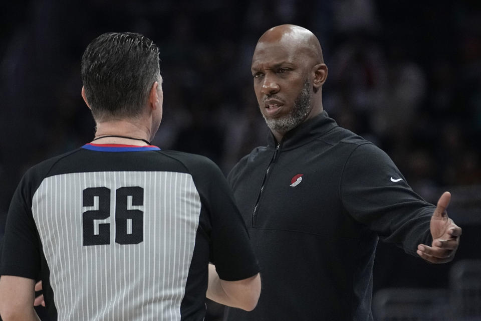 Portland Trail Blazers head coach Chauncey Billups, right, questions a call with referee Pat Fraher (26) during the second half of an NBA basketball game against the San Antonio Spurs in Austin, Texas, Thursday, April 6, 2023. (AP Photo/Eric Gay)