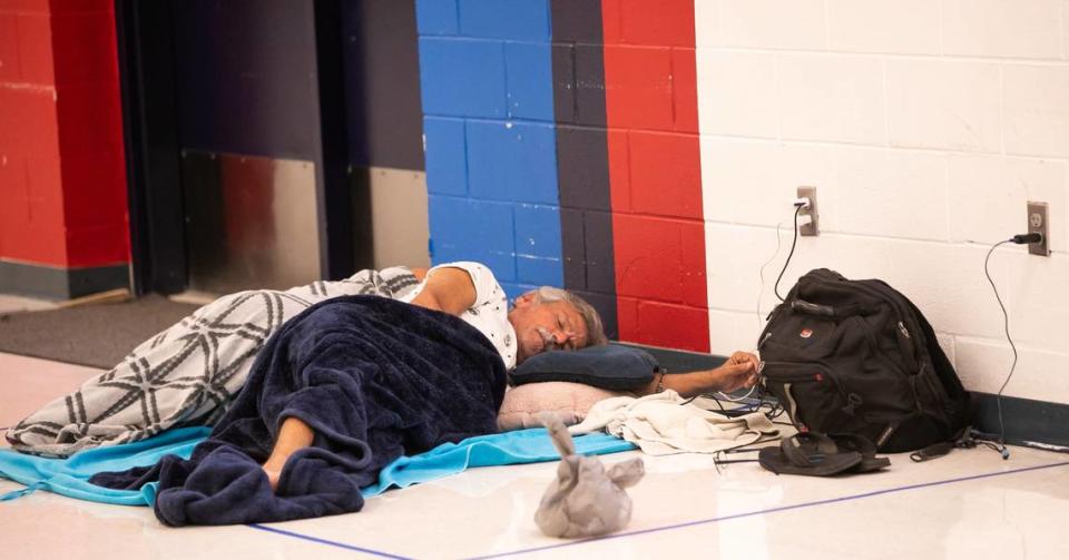 A man sleeps after arriving to the hurricane shelter at Vanguard High School Tuesday morning August 29, 2023 in Ocala, FL in preparation for Hurricane Idalia’s arrival. [Doug Engle/Ocala Star Banner]2023