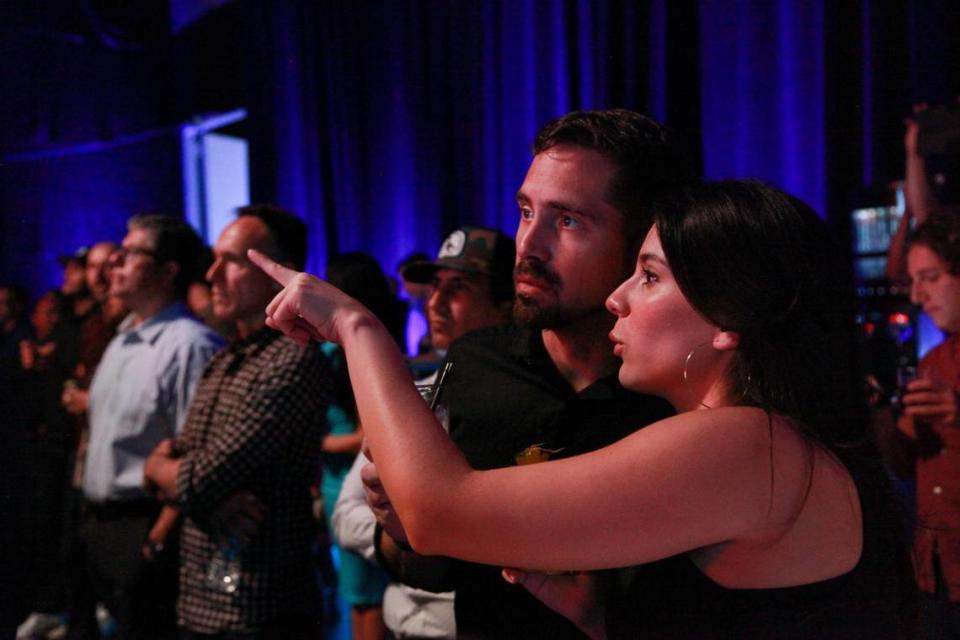 Mark Pulaski, 37, and Mariana Serrano, 28, watch during the unveiling of the Virtual Production LED Wall that is a the result of a collaboration between GRUP MEDIAPRO and BrandStar Studios on Tuesday, June 20, 2023 at the Mediapro studio in Medley, FL.