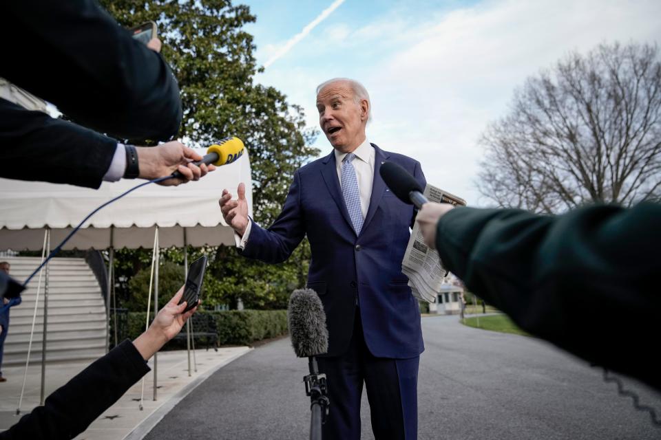 President Joe Biden stops to speak to reporters outside the White House on Feb. 24, 2023.