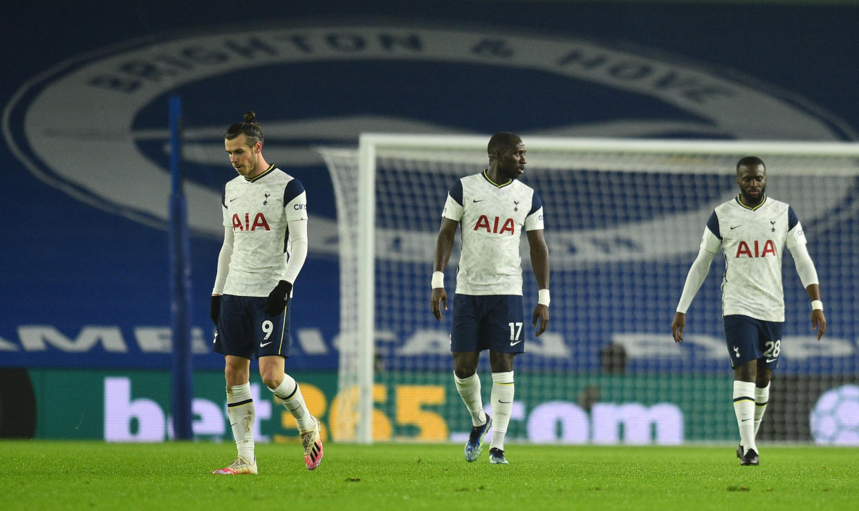 Tottenham Hotspur's (from left) Gareth Bale, Moussa Sissoko and Tanguy Ndombele looks dejected after Brighton's Leandro Trossard scores their first goal.