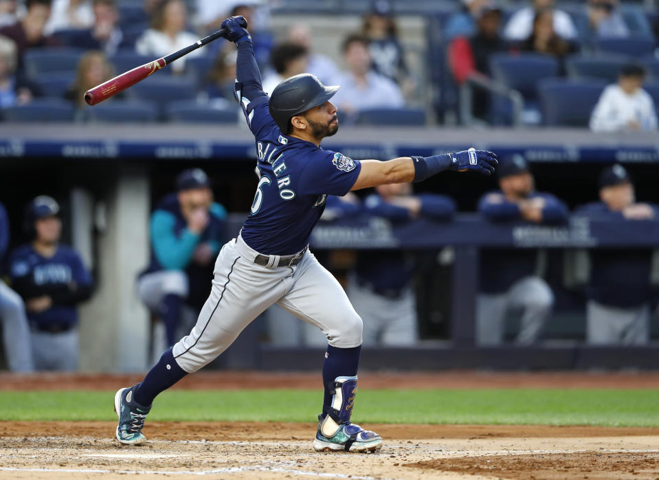 Seattle Mariners' Jose Caballero follows through on a sacrifice fly against the New York Yankees during the third inning of a baseball game Thursday, June 22, 2023 in New York. (AP Photo/Noah K. Murray)