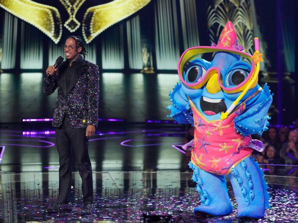Nick Cannon and Starfish in the season 11 premiere episode of The Masked Singer.