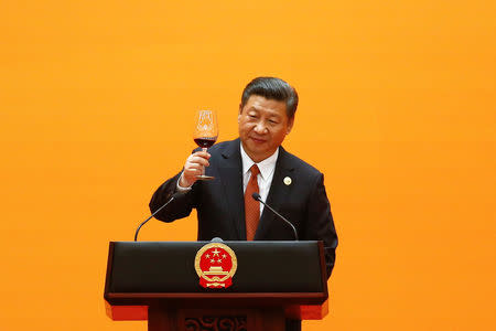 Chinese President Xi Jinping makes a toast at the beginning of the welcoming banquet at the Great Hall of the People during the first day of the Belt and Road Forum in Beijing, China May 14, 2017. REUTERS/Damir Sagolj/Files