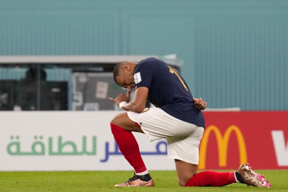 France's Kylian Mbappe celebrates after scoring his sides first goal during the World Cup group D football match between France and Denmark, at the Stadium 974 in Doha, Qatar, Saturday, Nov. 26, 2022. (AP Photo/Thanassis Stavrakis)