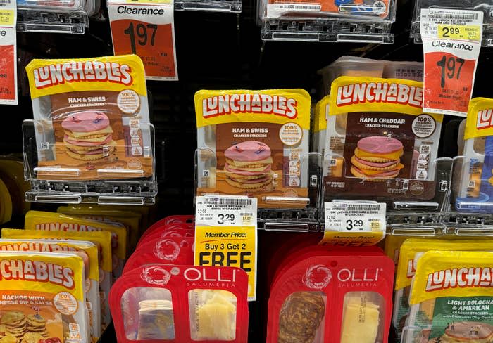 Lunchables products on a store shelf with price tags, promotional offer "Buy 3 Get 2 Free" visible