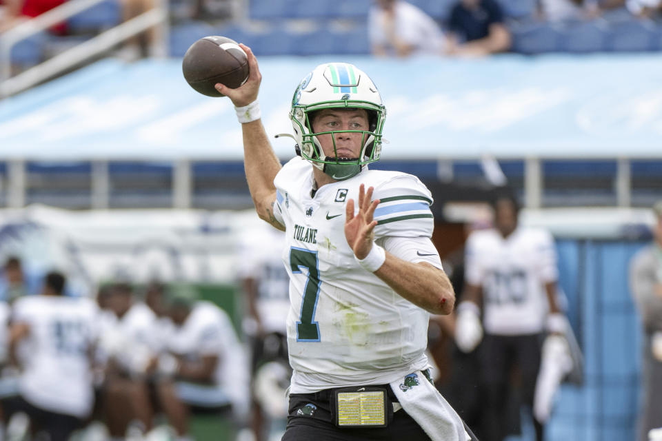 Tulane quarterback Michael Pratt (7) throws a touchdown pass to tight end Chris Carter (not shown) during the first half of an NCAA football game against Florida Atlantic, Saturday, Nov. 18, 2023, in Boca Raton, Fla. (AP Photo/Doug Murray)