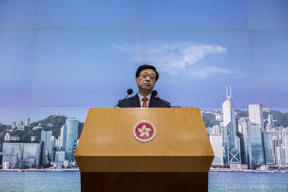 FILE - Hong Kong Chief Executive John Lee speaks during a news conference in Hong Kong, March 21, 2023. Lee said Tuesday, July 4, that eight pro-democracy activists who now live in the United States, Britain, Canada and Australia will be pursued for life for alleged national security offenses, dismissing criticism that the move to have them arrested was a dangerous precedent. (AP Photo/Louise Delmotte, File)