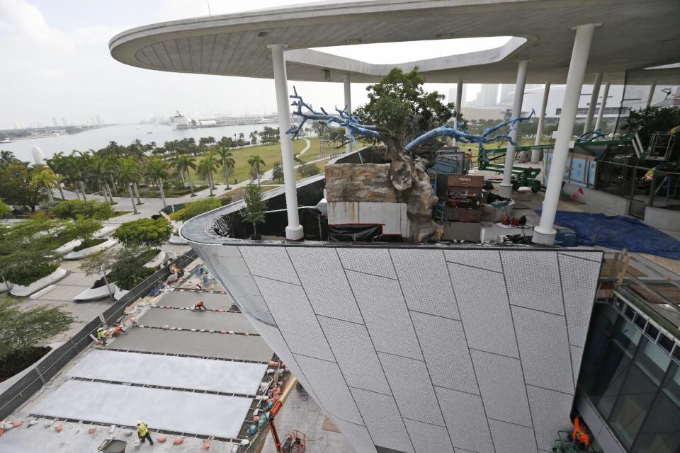 In this Thursday, Dec. 8, 2016 photo, section of the Patricia and Phillip Frost Museum of Science is shown during construction in Miami. Rising next to Miami's spiffy new bayside art museum is a $305 million science museum that, like South Florida, is focused in large part on water: its centerpiece is a 500,000-gallon aquarium that will feature sharks, tuna, mahi-mahi and even sea turtles, with other smaller tanks for corals and other sea life. The Frost Science Museum, scheduled to open this spring. (AP Photo/Wilfredo Lee)