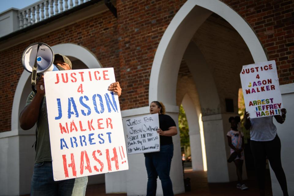 Shaun McMillan and handful of other demonstrators shout out Jason Walker's name to people attending the Dogwood Festival during a Justice for Jason Walker demonstration on Saturday, April 23, 2022. Jason Walker, 37, was shot and killed by off-duty Cumberland County Sheriff's deputy Lt. Jeffrey Hash. The special prosecutor who reviewed charges in the fatal shooting of Jason Walker on Jan. 8, has declined to pursue criminal charges against Hash.