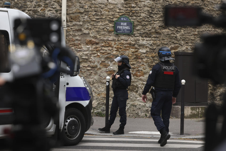 Police officers patrol near the Iranian consulate, Friday, April 19, 2024 a in Paris. Paris police said Friday they are carrying out an operation at the Iranian consulate after a witness reported seeing a man outside carrying a grenade and an explosives vest. (AP Photo/Thomas Padilla)