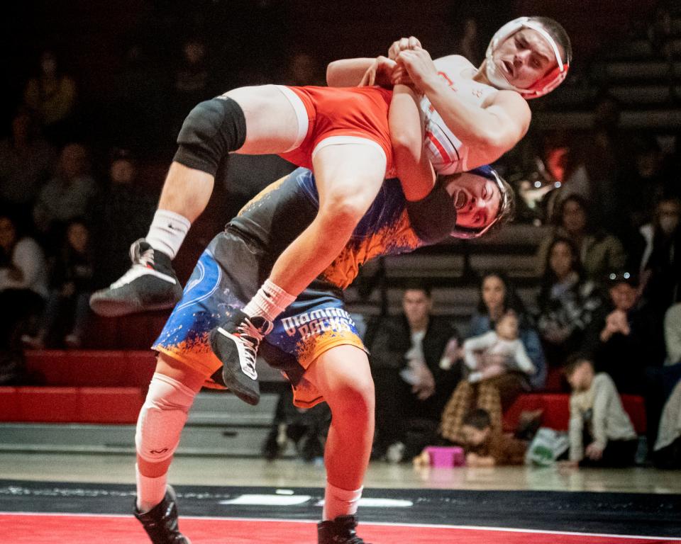 Serrano's Alex Martin attempts to throw Oak Hills' Dylan Bentz during their 160-pound match on Thursday, Jan. 20, 2022. Bentz won the match and Oak Hills claimed the Mojave River League wrestling title.