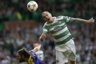 Celtic's Anthony Stokes (R) challenges NK Maribor's Marko Suler during their Champions League soccer match in Celtic Park Stadium, Glasgow, Scotland August 26, 2014. REUTERS/Russell Cheyne