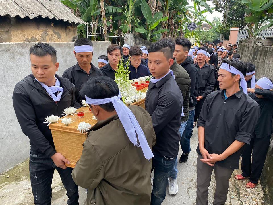 Relatives carry the coffin of Hoang Van Tiep to the church for a funeral ceremony Thursday, Nov. 28, 2019 in Dien Chau, Vietnam. The 18-year old Tiep was among the 39 Vietnamese who died when human traffickers carried them by truck to England in October, and whose remains were among the 16 repatriated to their homeland Wednesday. (AP Photo/Hau Dinh)