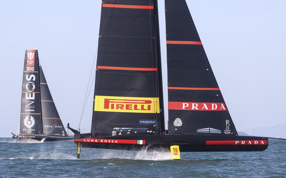 Italy's Luna Rossa, right, leads Britain's INEOS Team UK in race eight of the Prada Cup on Auckland's Waitemata Harbour, New Zealand, Sunday, Feb.21, 2021.Italian challenger Luna Rossa Prada Pirelli will race defender Emirates Team New Zealand in the 36th match for the America's Cup after beating Britain's Ineos Team UK in two races Sunday to seal a 7-1 win in the best-of-13 race challengers series final. (Brett Phibbs/NZ Herald via AP)