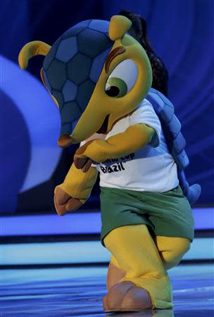 World Cup mascot Fuleco dances on stage during the draw for the 2014 World Cup at the Costa do Sauipe resort in Sao Joao da Mata, Bahia state, December 6, 2013. REUTERS/Ricardo Moraes