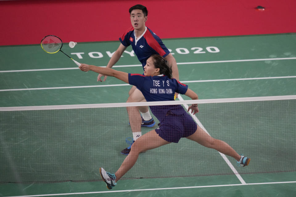 Hong Kong's Tang Chun Man and Tse Ying Suet polar against China's Zheng Si Wei and Huang Ya Qiong during their mixed doubles semifinal matchat the 2020 Summer Olympics, Thursday, July 29, 2021, in Tokyo, Japan. (AP Photo/Dita Alangkara)