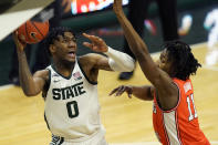 Michigan State forward Aaron Henry (0) looks to shoot as Illinois guard Ayo Dosunmu (11) defends during the second half of an NCAA college basketball game, Tuesday, Feb. 23, 2021, in East Lansing, Mich. (AP Photo/Carlos Osorio)