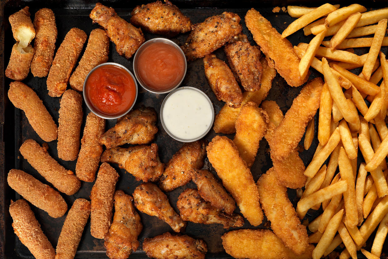 Mozzarella sticks, chicken wings, french fries and chicken fingers Getty Images/LauriPatterson