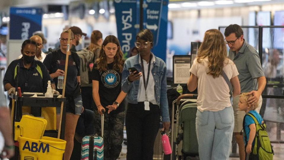 Lines form at TSA checkpoints Friday morning, July 1, 2022 at the Charlotte Douglas International Airport.